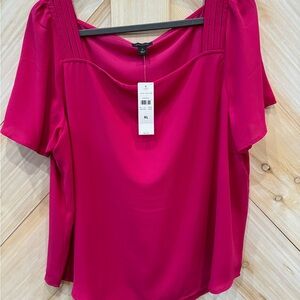 Pink short sleeve top.
